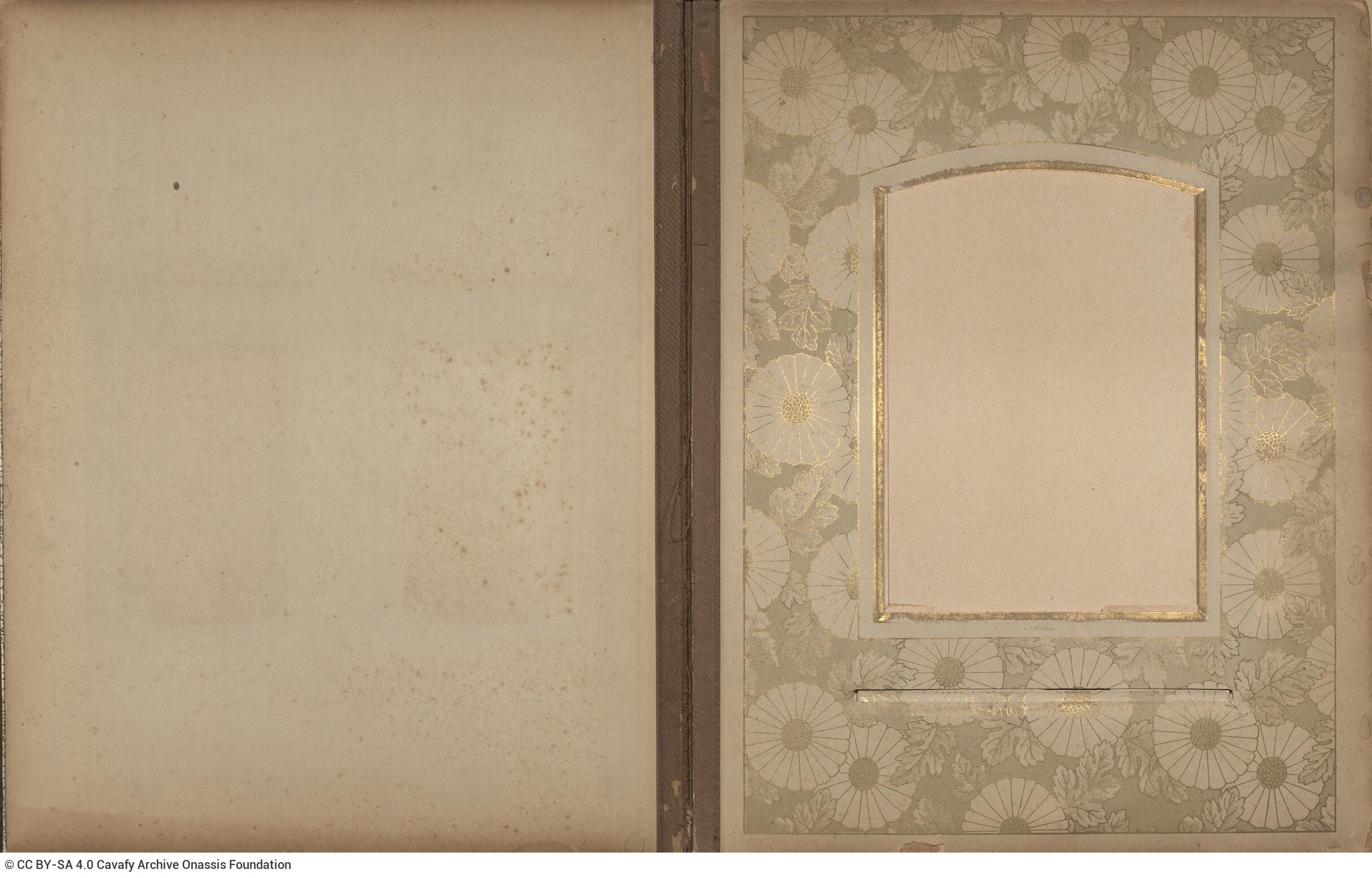 Photo album made of leather with details of metallic flowers and metallic lock. The photo frames are empty.