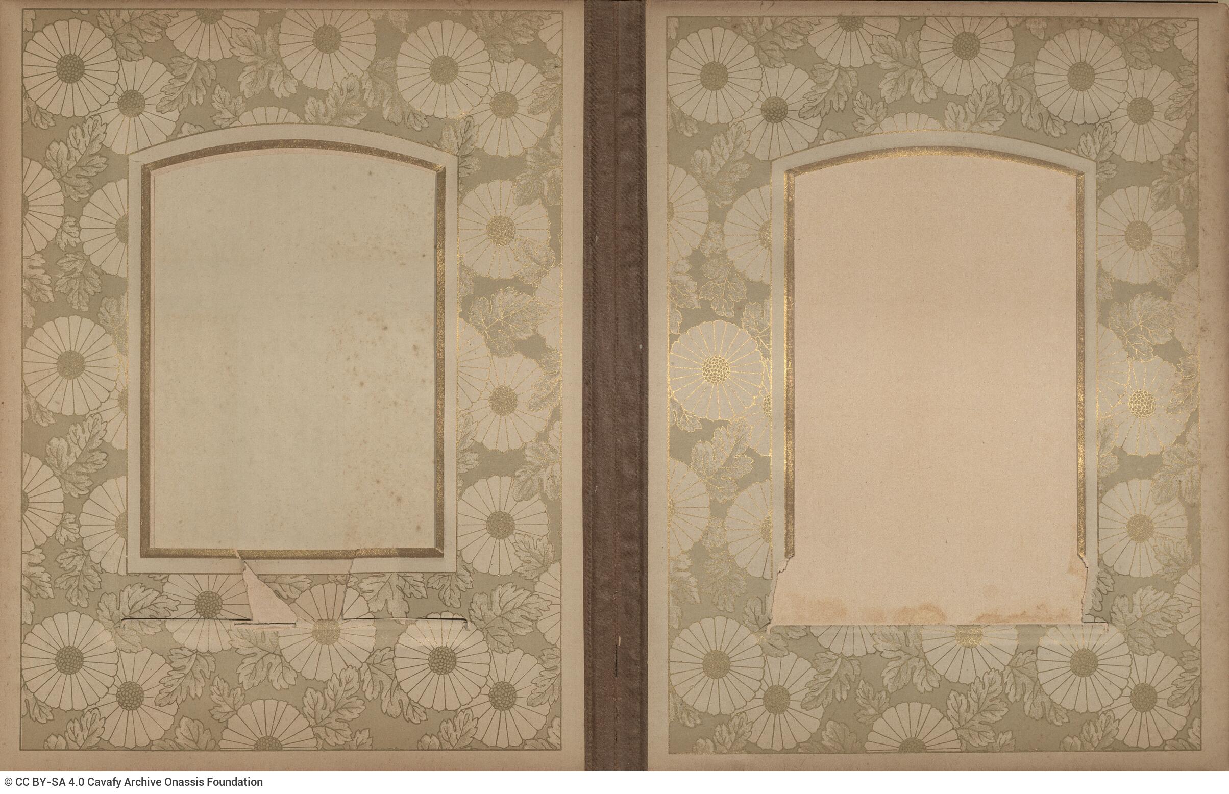 Photo album made of leather with details of metallic flowers and metallic lock. The photo frames are empty.