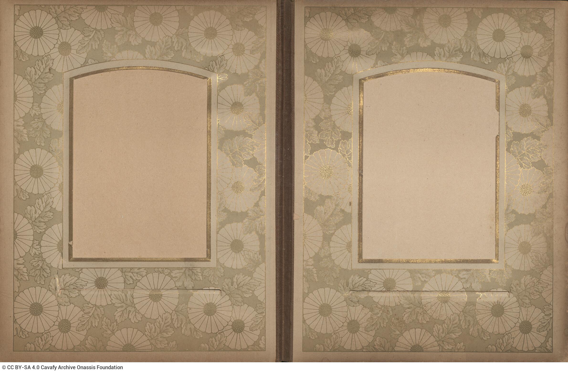 Photo album made of leather with details of metallic flowers and metallic lock. The photo frames are empty.