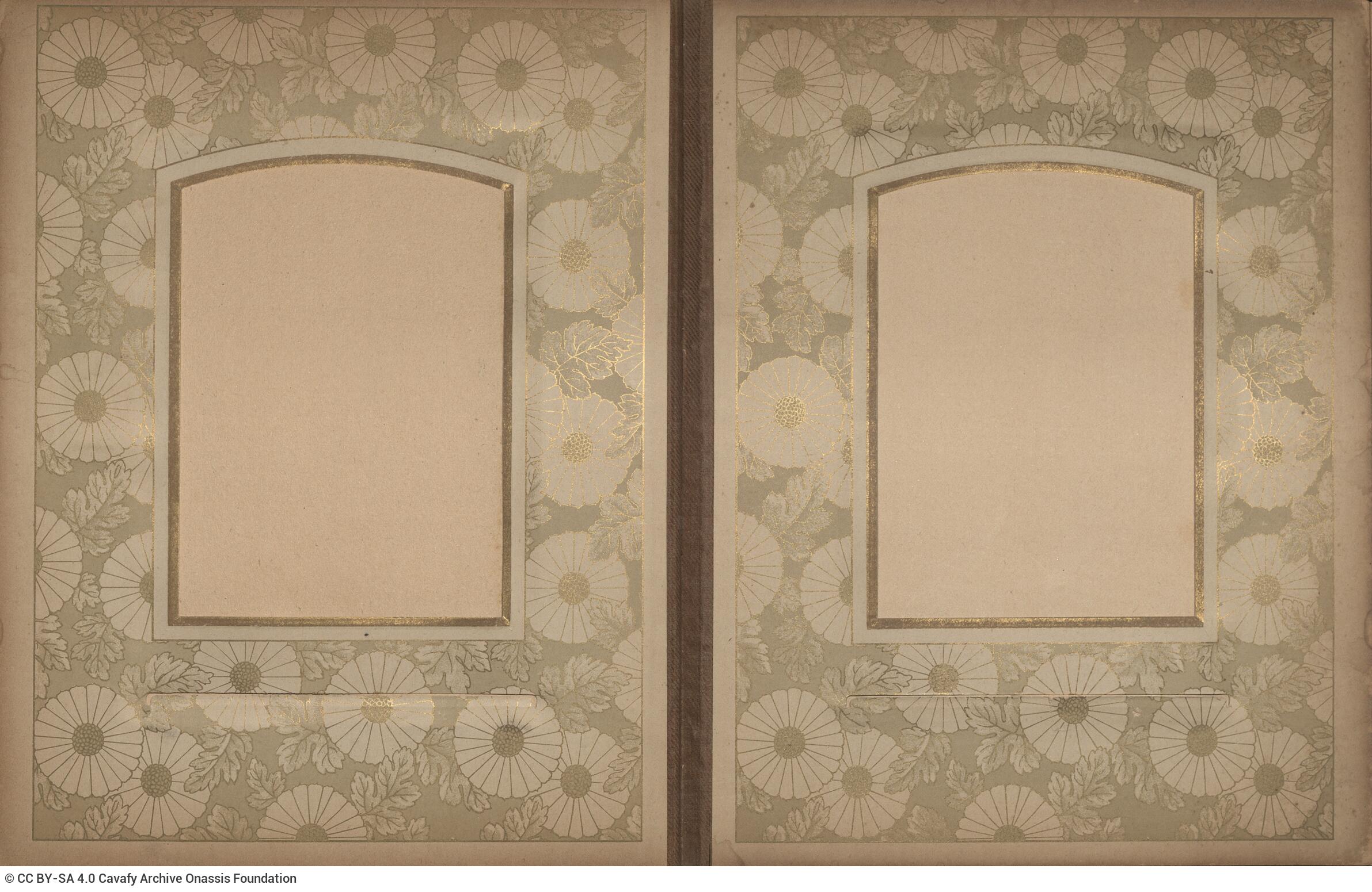 Photo album made of leather with details of metallic flowers and metallic lock. The photo frames are empty.