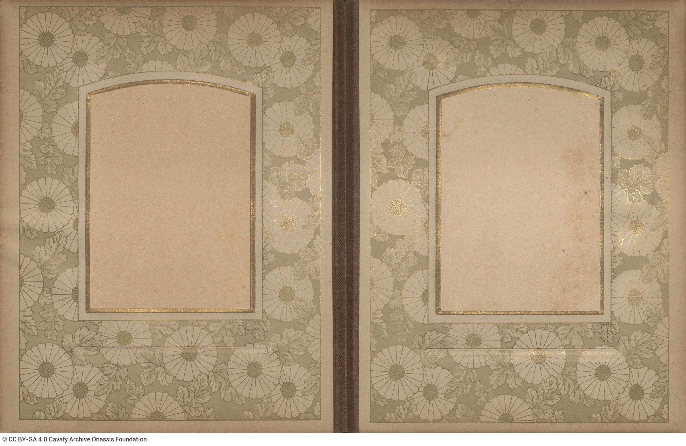 Photo album made of leather with details of metallic flowers and metallic lock. The photo frames are empty.