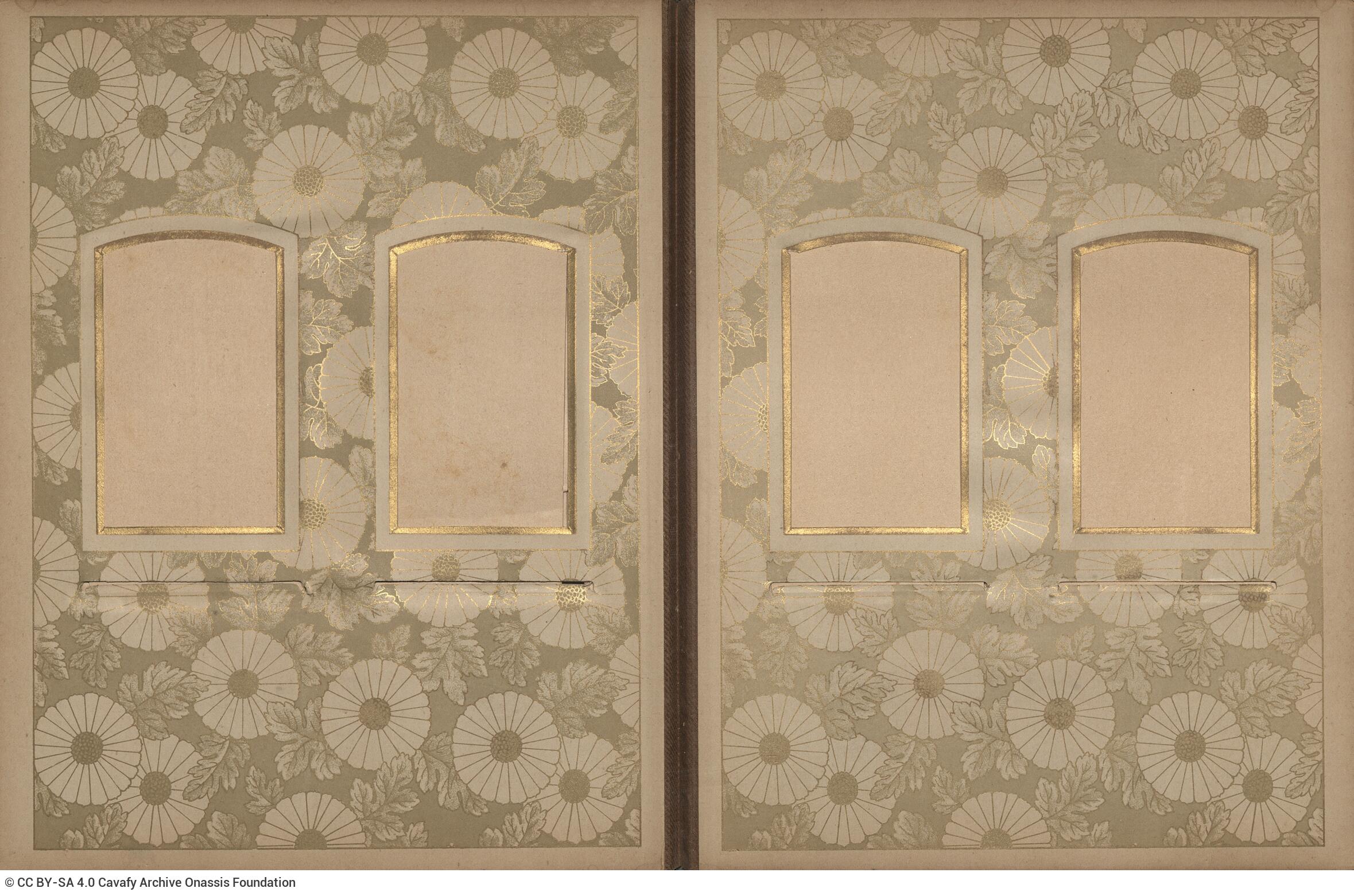 Photo album made of leather with details of metallic flowers and metallic lock. The photo frames are empty.