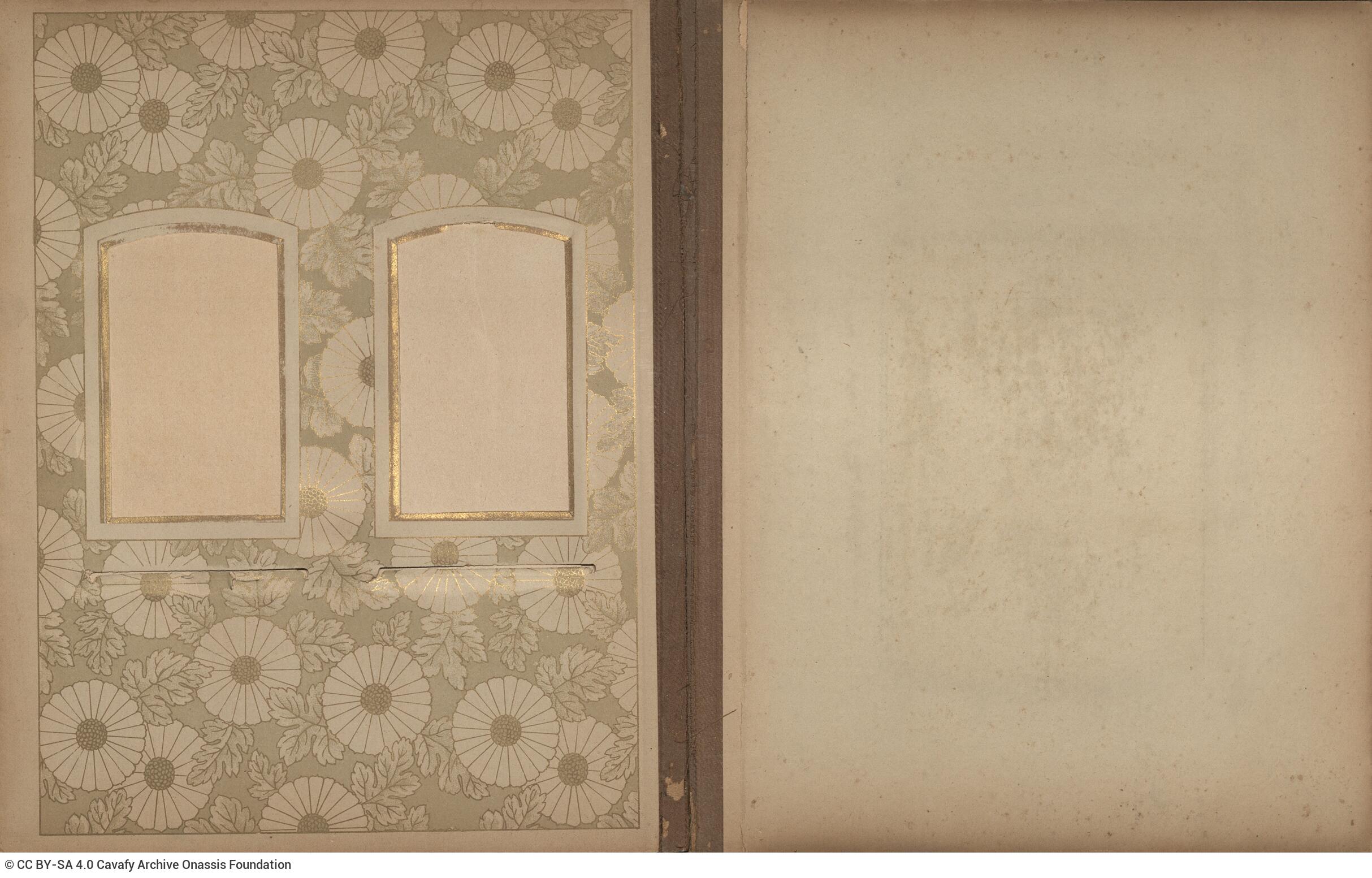 Photo album made of leather with details of metallic flowers and metallic lock. The photo frames are empty.