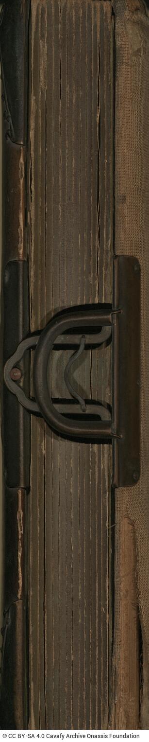 Photo album made of leather with details of metallic flowers and metallic lock. The photo frames are empty.