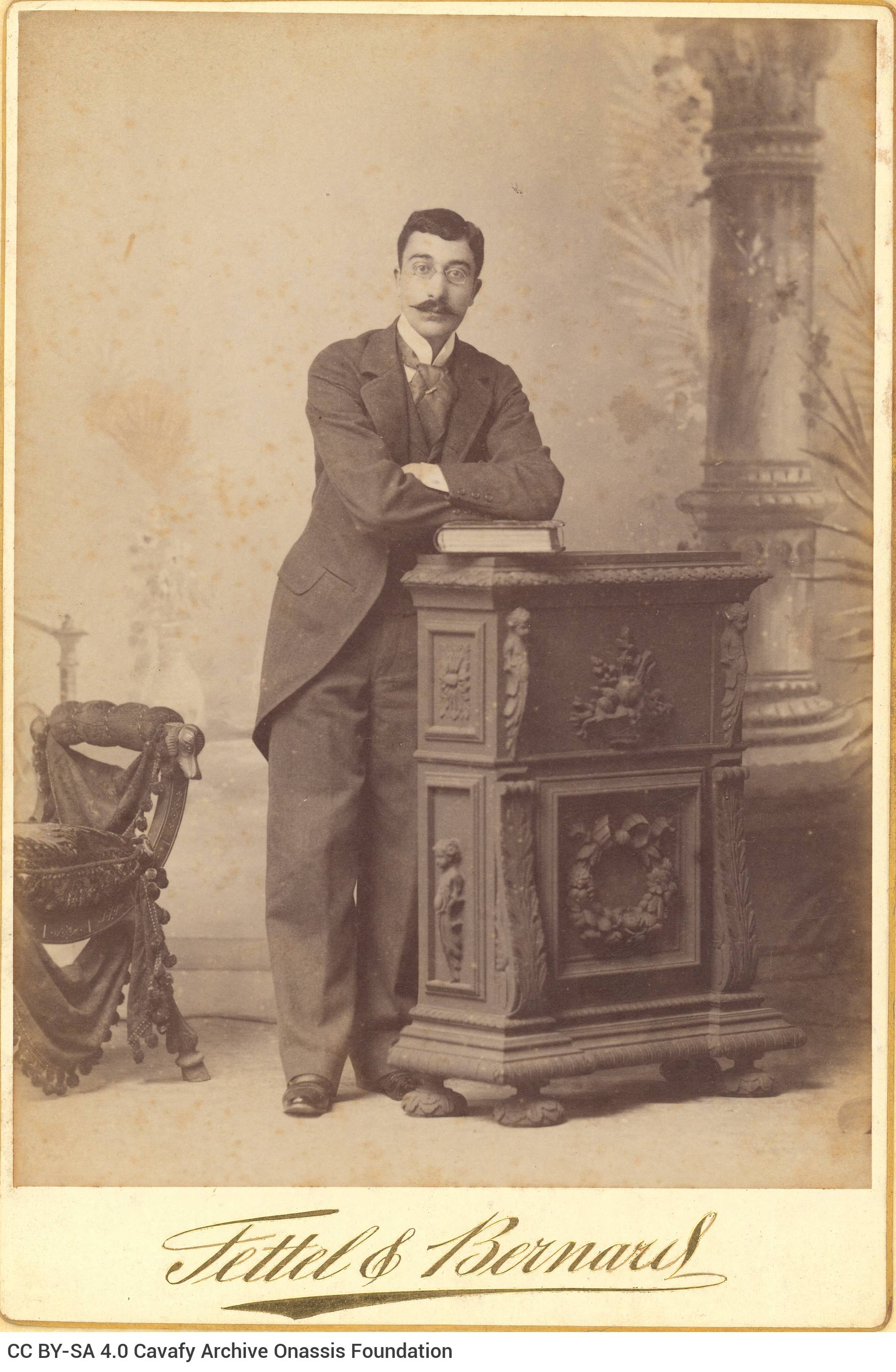 Undated photographic portrait of Cavafy by the photo shop of Fettel & Bernard in Alexandria, in three copies. The poet has a 