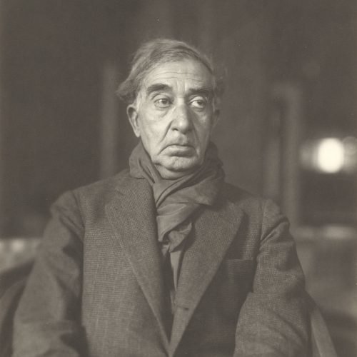 Undated photographic portrait of Cavafy wearing an overcoat and a scarf. The photograph was taken in the workshop of sculptor