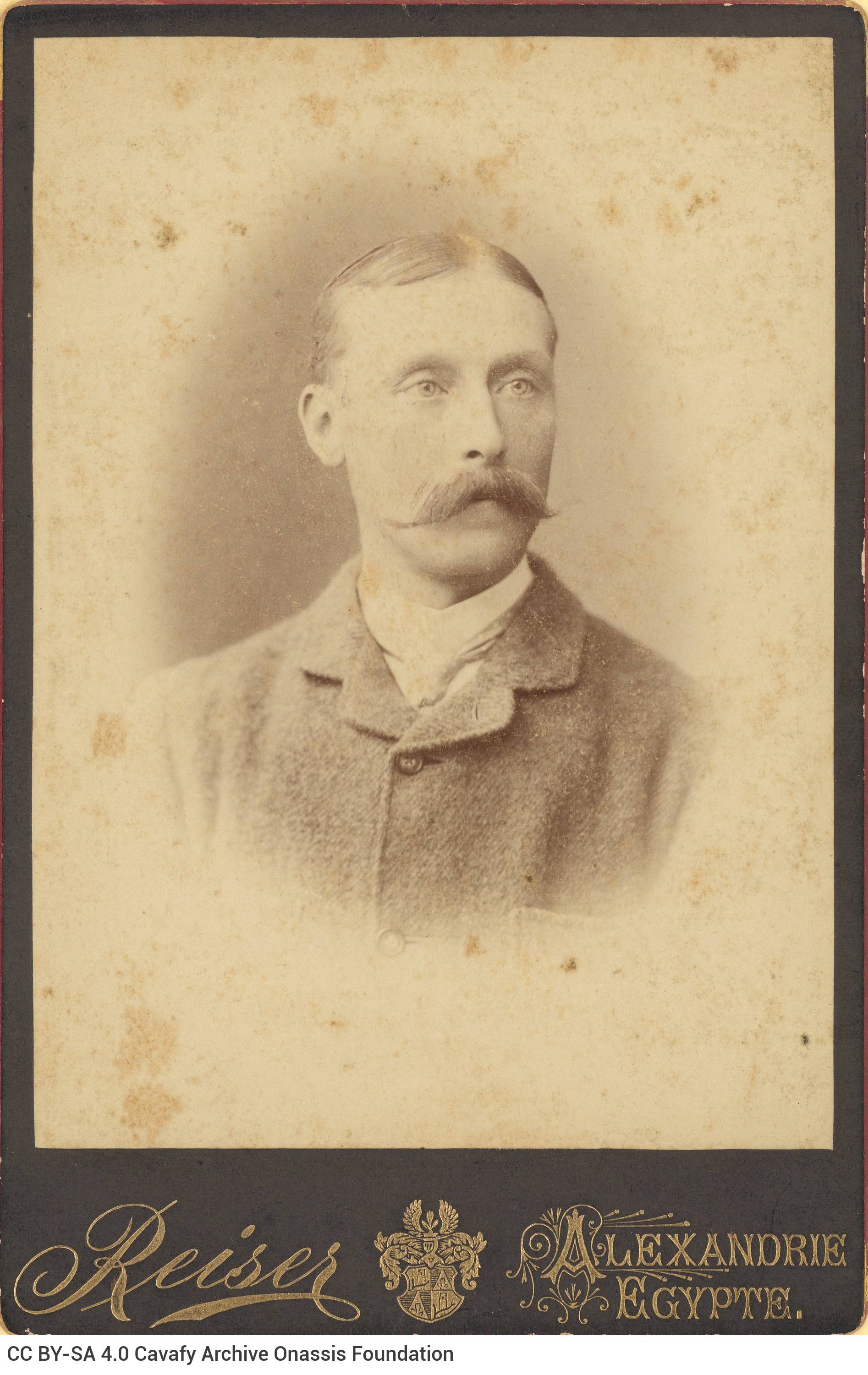 Undated photograph of an unknown man in a moustache The photographer's logo in the lower part of the frame.