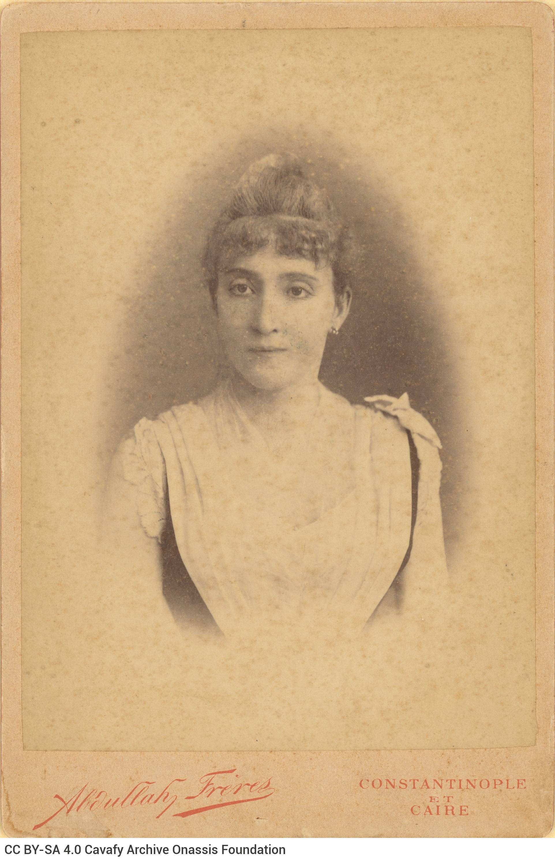 Photographic portrait of the poet's aunt, Euvoulia Papalamprinou, née Fotiadi. The logo of the photo shop in the lower part 