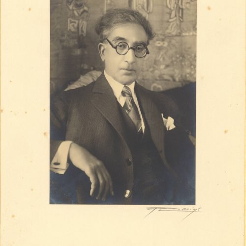Photographic portrait of Cavafy at a mature age in his flat, pasted on paperboard and covered in rice paper with the logo of 