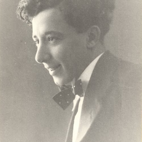 Later enlarged copy of a photograph of Alekos Singopoulo in his youth. He is depicted in profile, smiling, looking to the lef