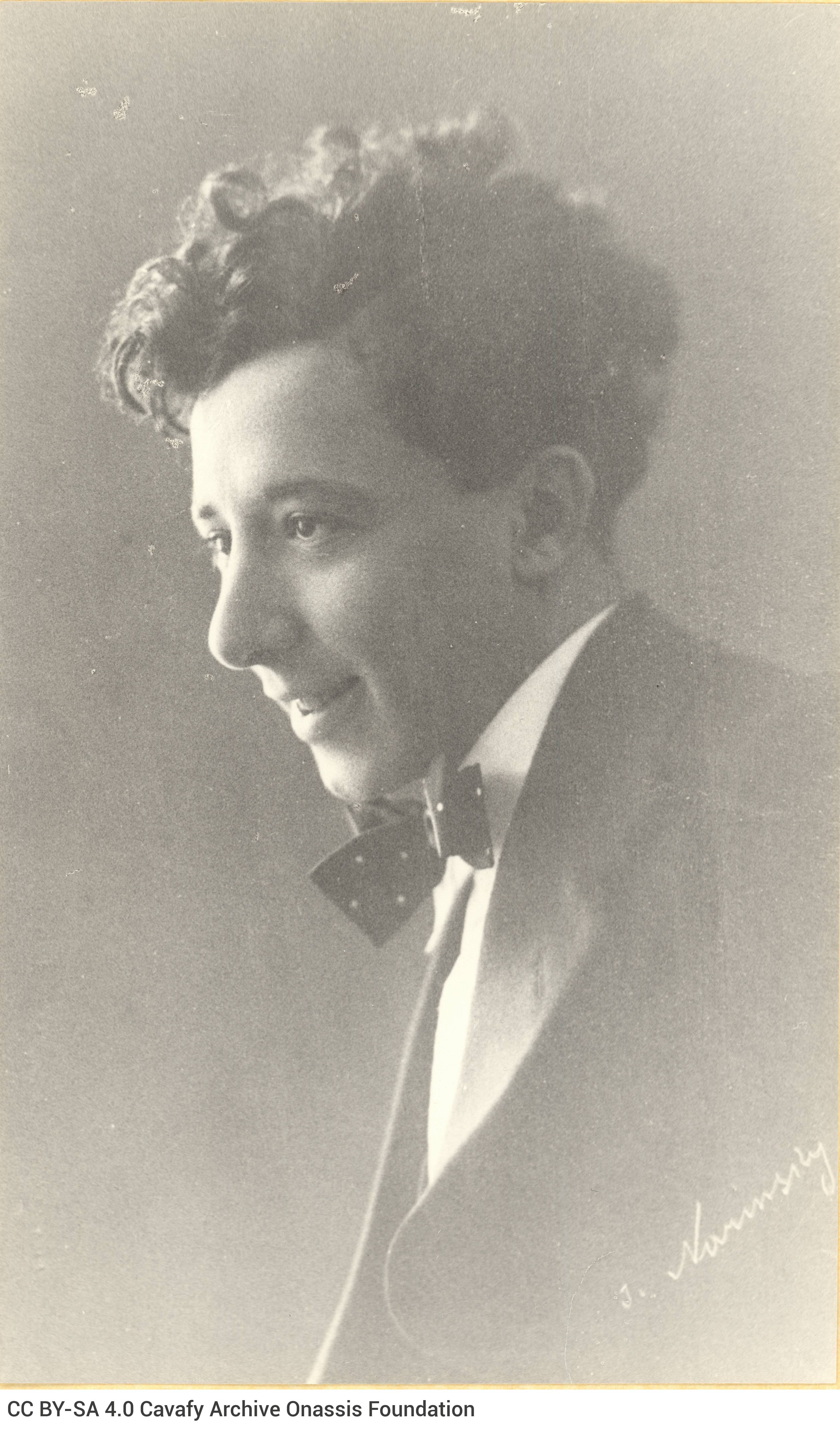 Later enlarged copy of a photograph of Alekos Singopoulo in his youth. He is depicted in profile, smiling, looking to the lef